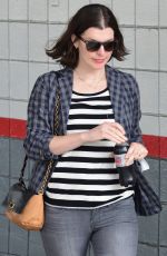 MILLA JOVOVICH Out and About in Los Angeles