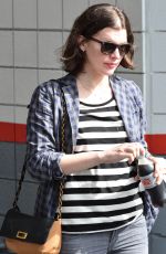 MILLA JOVOVICH Out and About in Los Angeles