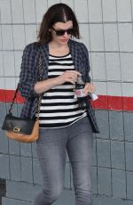 MILLA JOVOVICH Out and About in Los Angeles