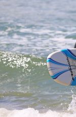 ROSAMUND PIKE in Bikini Paddle Boarding in Hawaii
