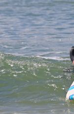 ROSAMUND PIKE in Bikini Paddle Boarding in Hawaii
