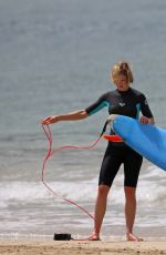ROSAMUND PIKE in Bikini Paddle Boarding in Hawaii
