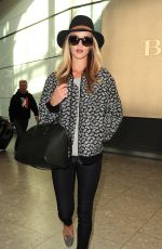 ROSIE HUNTINGTON-WHITELEY Arrives at Heatrow Airport in London