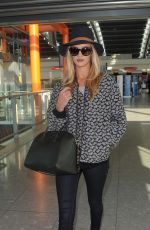 ROSIE HUNTINGTON-WHITELEY Arrives at Heatrow Airport in London
