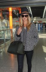 ROSIE HUNTINGTON-WHITELEY Arrives at Heatrow Airport in London