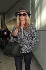 ROSIE HUNTINGTON-WHITELEY Arrives at Heatrow Airport in London