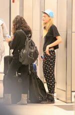CARA DELEVINGNE and MICHELLE RODRIGUEA Arrives at Miami Airport