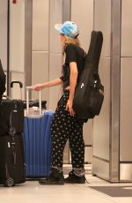 CARA DELEVINGNE and MICHELLE RODRIGUEA Arrives at Miami Airport