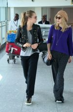 CARA DELEVINGNE and SUKI WATERHOUSE at Heathrow Airport in London