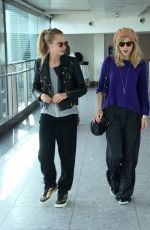 CARA DELEVINGNE and SUKI WATERHOUSE at Heathrow Airport in London