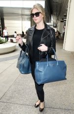 KATE UPTON Arrives at Los Angeles International Airport