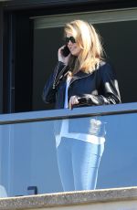 KATE UPTON in Jeans on a Hotel Balcony in Sydney