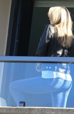 KATE UPTON in Jeans on a Hotel Balcony in Sydney