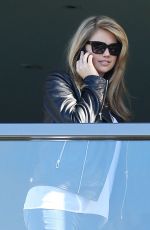 KATE UPTON in Jeans on a Hotel Balcony in Sydney