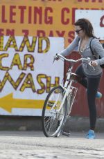 MARGOT ROBBIE Riding a Bike Out in London