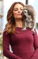 MARIA MENOUNOS on the Set of Extra in Los Angeles