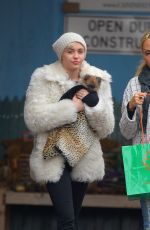 MILEY CYRUS Gets a New Dog While in New York