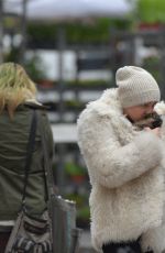 MILEY CYRUS Gets a New Dog While in New York