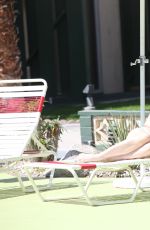 PHOEBE PRICE in Bikini at a Pool in Palm Springs