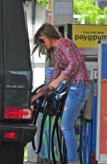 ABBIGAIL ABBEY CLANCY in Ripped Jeans at a Gas Station in London