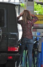 ABBIGAIL ABBEY CLANCY in Ripped Jeans at a Gas Station in London