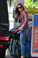 ABBIGAIL ABBEY CLANCY in Ripped Jeans at a Gas Station in London