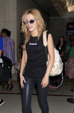 BELLA THORNE Arrives at LAX Airport in Los Angeles