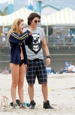 BELLA THORNE in Bikini Covered at a Beach in Santa Monica