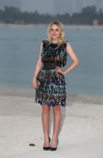 DAKOTA FANNING at Chanel Cruise Fashion Show in Dubai