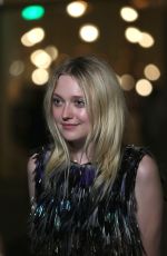 DAKOTA FANNING at Chanel Cruise Fashion Show in Dubai