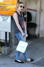 EMMA ROBERTS heading to Nine Zero One Salon in Los Angeles