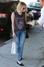 EMMA ROBERTS heading to Nine Zero One Salon in Los Angeles