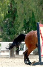 KALEY CUOCO Rides a Horse at a Ranch in Simi Valley