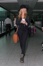 LAURA WHITMORE at Arrives at Heathrow Airport in London