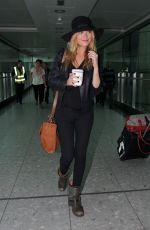 LAURA WHITMORE at Arrives at Heathrow Airport in London