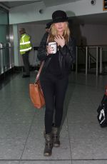 LAURA WHITMORE at Arrives at Heathrow Airport in London