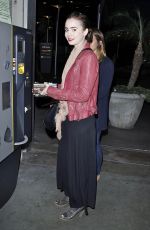 LILY COLLINS Arrives at a Movie Theatre in Hollywood