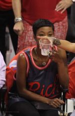 RIHANNA Shows Pink Hair at the Clippers Game in Los Angeles