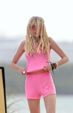 TAYLOR MOMSEN on the Set for a Music Video at a Beach in Miami