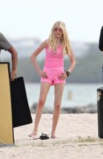 TAYLOR MOMSEN on the Set for a Music Video at a Beach in Miami