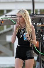 TAYLOR MOMSEN on the Set for a Music Video at a Beach in Miami