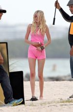 TAYLOR MOMSEN on the Set for a Music Video at a Beach in Miami
