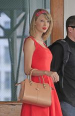 TAYLOR SWIFT in Red Dress Leaves Her Apartment in New York