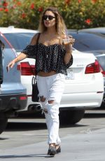 VANESSA HUDGENS in Ripped Jeans at Coffee Bean in Los Angeles