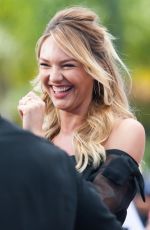 CANDICE SWANEPOEL on the Set of Extra in Universal City