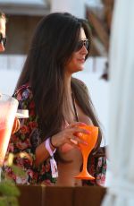CASEY BATCHELOR in Bikini Top at Ocean Beach in Ibiza