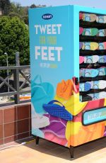 EMMA ROBERTS at Old Navy Flip-flop Vending Machine in Los Angeles