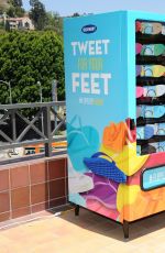 EMMA ROBERTS at Old Navy Flip-flop Vending Machine in Los Angeles