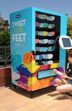 EMMA ROBERTS at Old Navy Flip-flop Vending Machine in Los Angeles