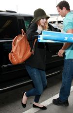 EMMA STONE Arrives at Los Angeles International Airport